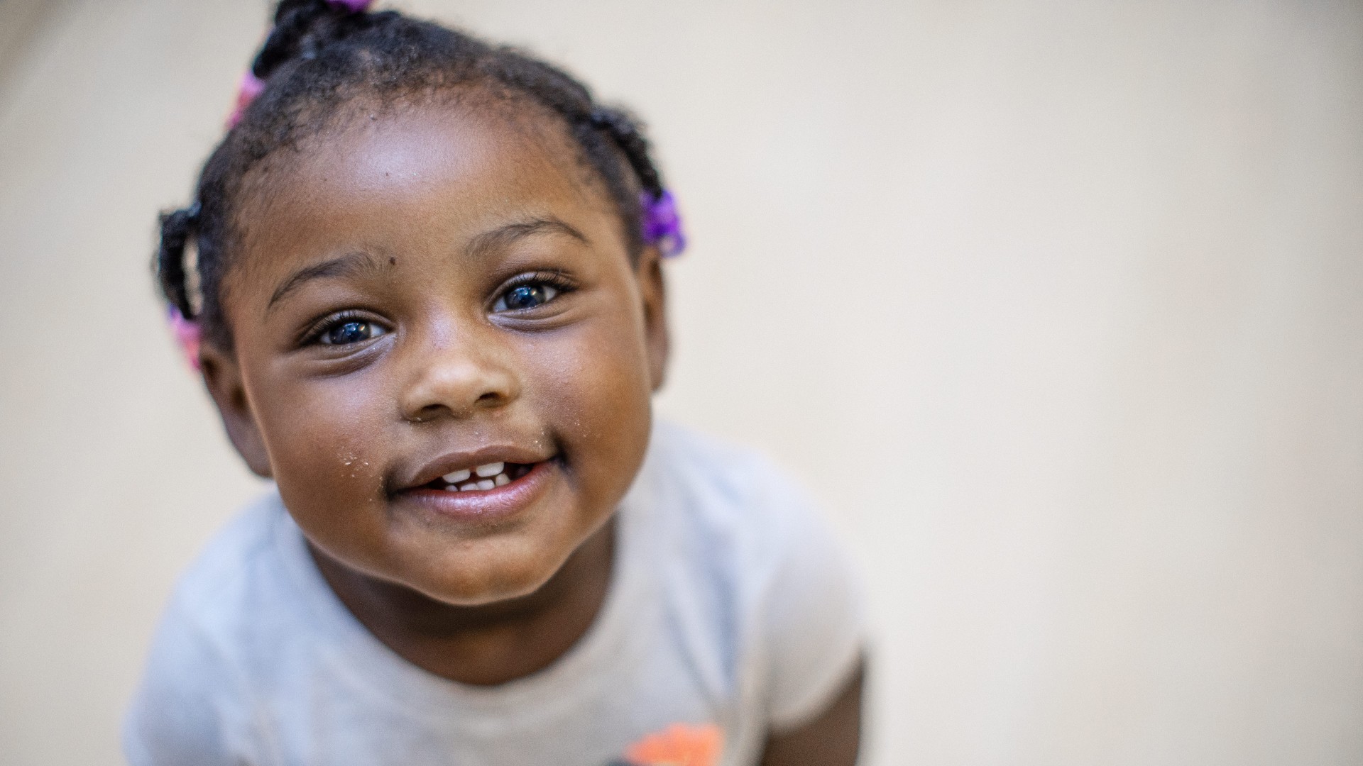 Young girl looking up and smiling